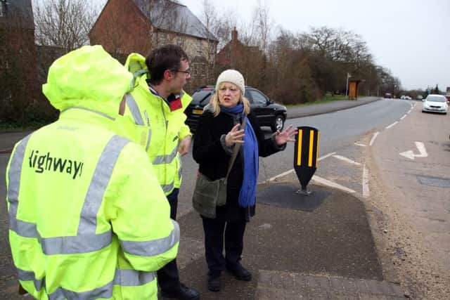 Pedestrian Cross: Desborough: resident Marianne Lendrum who uses buses meets with highways officials to discuss getting a safe crossing to the bus stop in Harborough Road. Marianne with Mathew Barber (Northamptonshire Highways)Tuesday February 28 2017 NNL-170228-195812009
