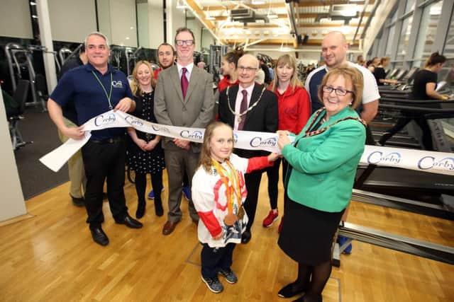 Ellie Robinson, who swims for Northampton Swimming Club and trains once a week at Corby International Swimming Pool, helps to relaunch the gym with Mayor of Corby Julie Riley