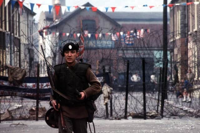 File photo dated 01/10/1969 of a British soldier of the Queen's Regiment on duty beside a barricade in the Falls Road area of Belfast. PRESS ASSOCIATION Photo. Issue date: Monday July 30, 2007. The Army's 38-year operation in Northern Ireland, known as Operation Banner, comes to an end at midnight. It has been the Army's longest continuous campaign in its history, with more than 300,000 personnel serving over 38 years and 763 soldiers killed. See PA story ULSTER Military. Photo credit should read: PA Wire Ulster_Drumcree_barbed_wire