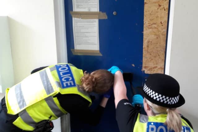 Police search the property before gaining entrance.