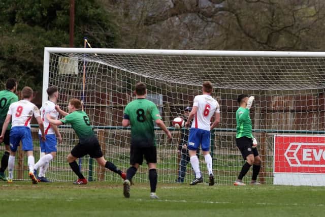 Darren Chadwick heads off to celebrate after scoring Leek Town's equaliser