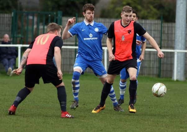 Action from Whitworth's 2-1 victory over Lutterworth Athletic. Pictures by Alison Bagley