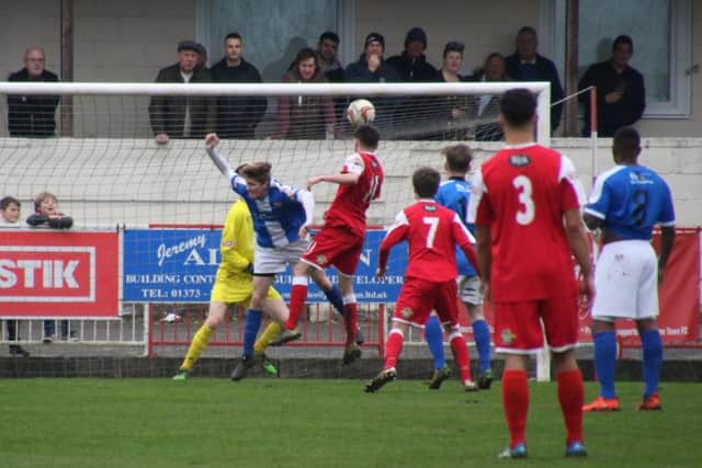 James Fitzgibbon heads home Frome's second goal against Kettering
