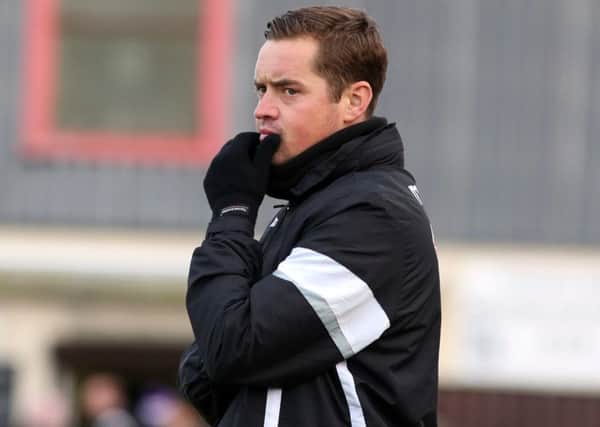 Gary Mills takes his Corby Town team to Marine for a crucial clash tonight