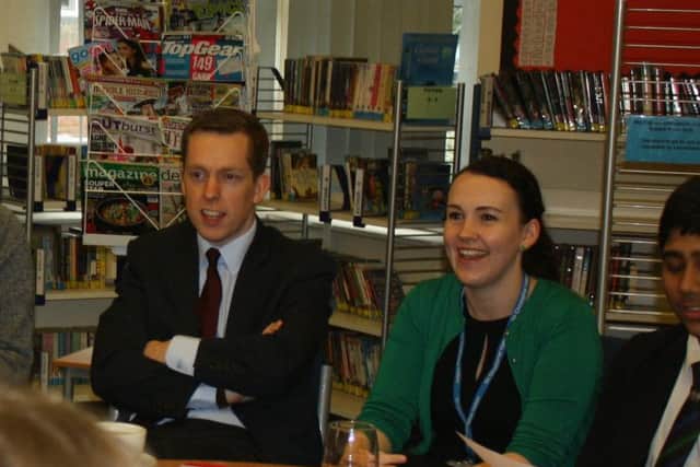 Tom chats to pupils.