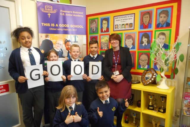 Pupils and Mrs Wallis-O'Dell celebrate the new Ofsted grade.