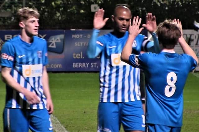 Phil Trainer takes the congratulations after scoring one of his goals in Corby Town's 3-2 loss at Marine last night. Picture by David Tilley