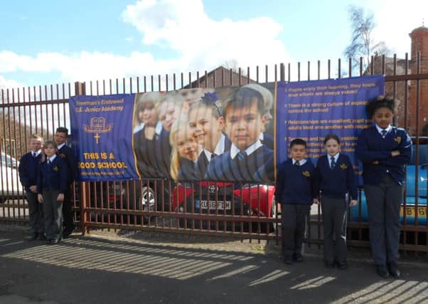 Pupils at Freeman's Endowed with the banner before it had to come down