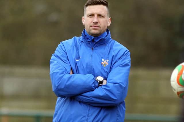 Stuart Goosey's Wellingborough Town take on local rivals Desborough Town tomorrow