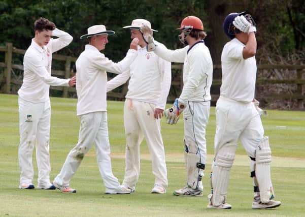 Horton House celebrate claiming a wicket in their NCL Premier Division win at Rushton (Pictures: Alison Bagley)