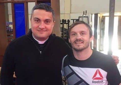 Rev Paul Frost (left) with UFC fighter Brad Pickett, who grew up in the area.