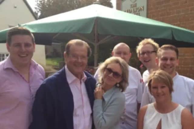 Sir Roger Moore at The Red Lion pub in East Haddon in 2014