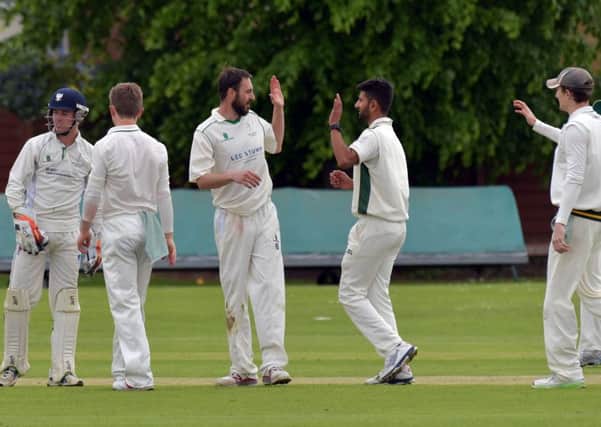 Saints celebrate a wicket in their defeat to Old Northamptonians (Pictures: Dave Ikin)
