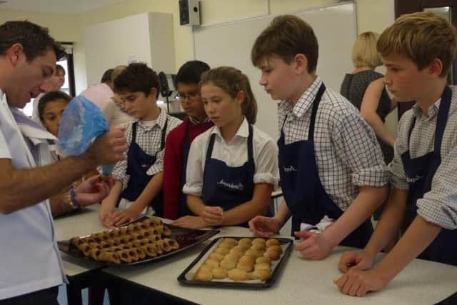 Top chef Gino dAcampo at a cookery class.