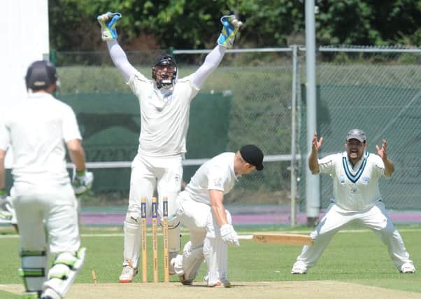 Wicketkeeper William Bates celebrates as Peterboroughs Alex Mitchell is bowled by Mudassar Hussain Ansari during Rushdens fine four-wicket success at Bretton Gate last weekend