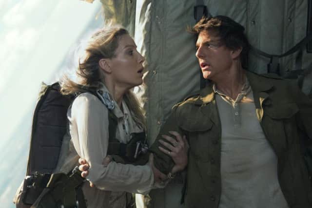 Annabella Wallis as Jenny Halsey and Tom Cruise as Nick Morton