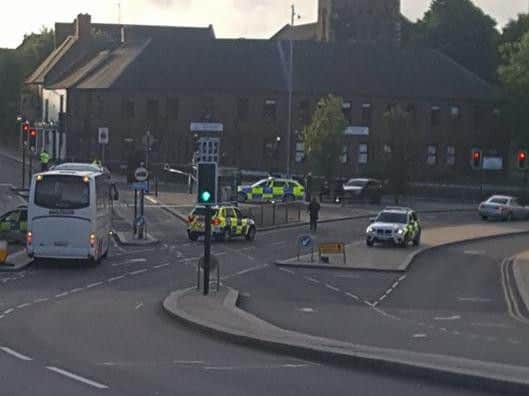 Police at the junction of Black Lion Hill early on Sunday morning. The force has reported that a man has died.