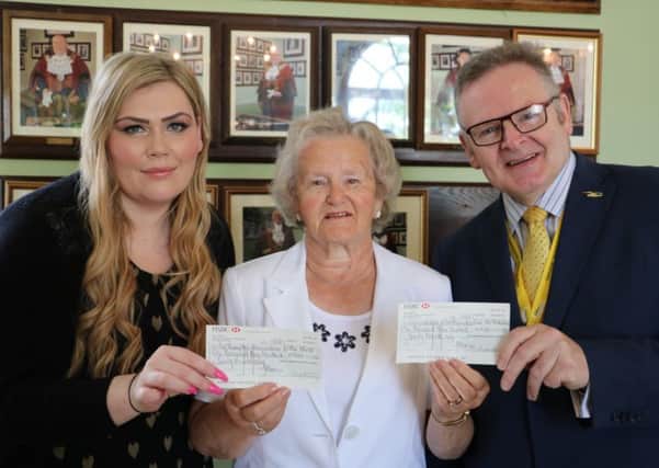 Cllr Pam Whiting handing over the cheques to her chosen charities