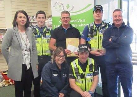 Paul Marlow receiving the cheque for Lakelands Hospice