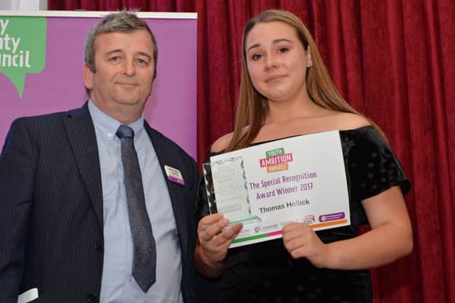 John Heron of NCC Fostering Service presents the Special Recognition Award to Thomas Hollick, who sadly died after being nominated. The award was collected by Elaina Falvey.