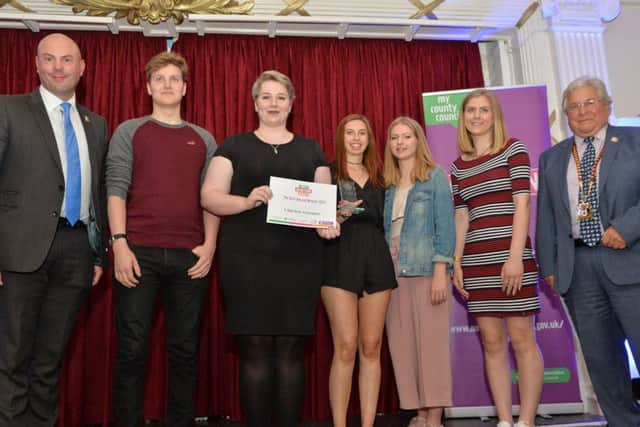 Councillor Matt Golby and Councillor Dudley Hughes present the Arts Award to Y-Not Volunteers who support young people with special needs.
