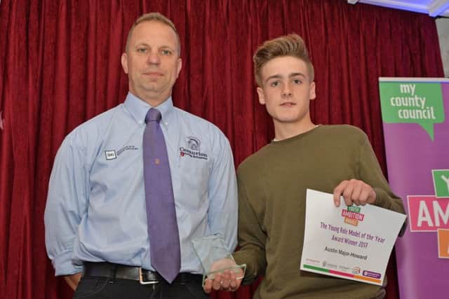 Val Rogers of Centurion presents Austin Major-Howard with his Young Role Model of the Year Award.