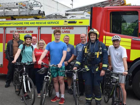 Paul Cushing (second from right) prepares to set off on his fundraising ride with (from left to right) sister-in-law Esme, son Reece and NFRS colleague Kev Hardwick outside Moulton station