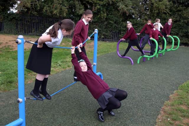 Pupils trying out the new play equipment