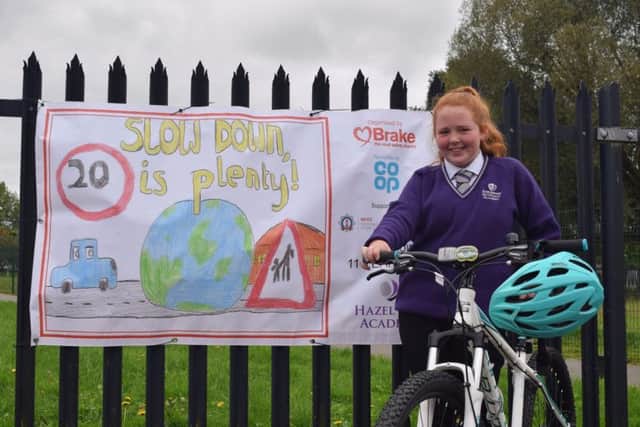 Alex with some of her prizes and the winning sign