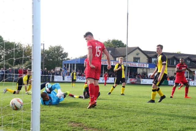 Aaron O'Connor scores the Poppies' third goal to round off a fine win