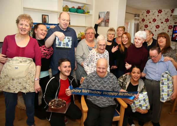 Birthday Celebration: Kettering: Robin SMith, who was born with Down Syndrome, celebrating his 76th birthday with friends and carers at his home in Kettering. 
Monday October 9th 2017 NNL-170910-205403009