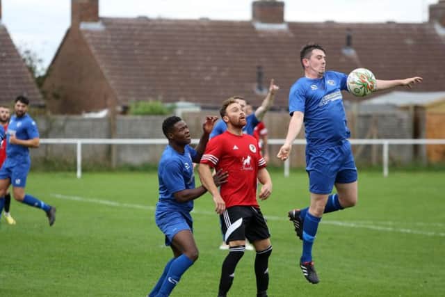 Action from Irchester United's 3-2 defeat to Harrowby United in the UCL Knockout Cup last weekend. Picture by Alison Bagley