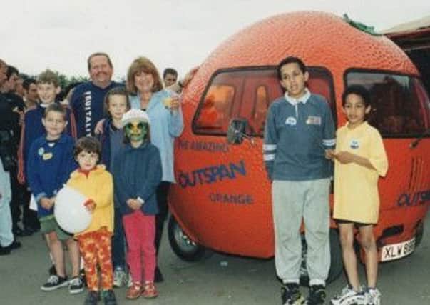 Geoff Quaife with the Outspan Orange car