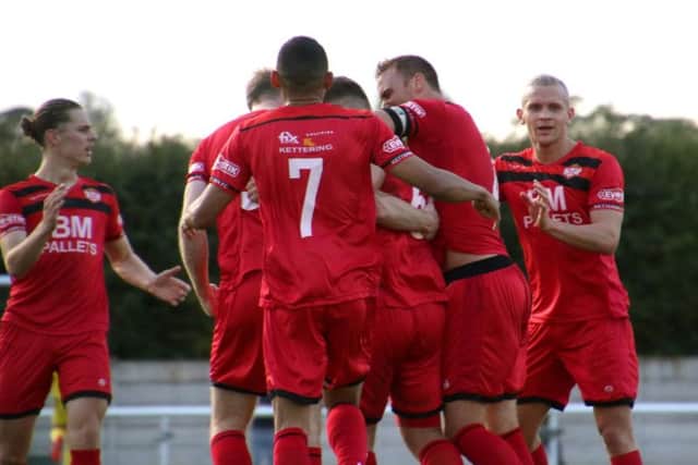 Michael Richens is mobbed by his Kettering Town team-mates after giving them the lead at Nantwich. Picture by Peter Short