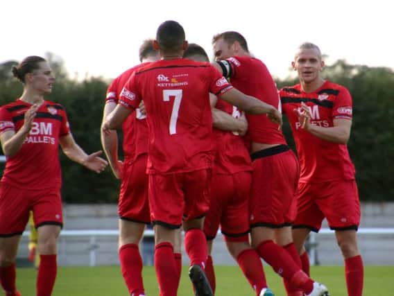 Michael Richens is mobbed by his Kettering Town team-mates after giving them the lead at Nantwich. Picture by Peter Short