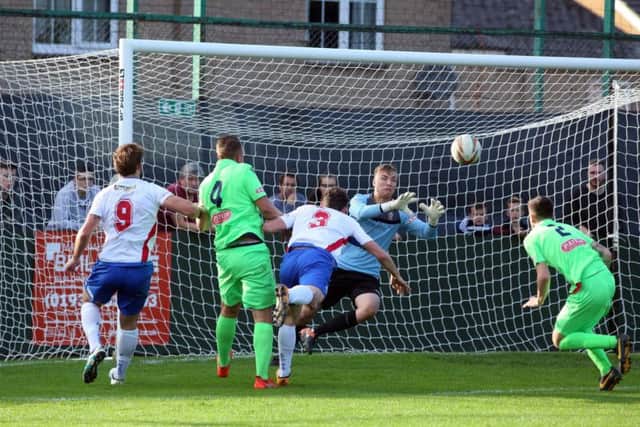 Sam Brown heads towards goal during AFC Rushden & Diamonds' 0-0 draw with Egham Town at Hayden Road. Pictures by Alison Bagley