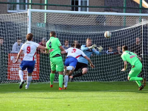 Sam Brown heads towards goal during AFC Rushden & Diamonds' 0-0 draw with Egham Town at Hayden Road. Pictures by Alison Bagley