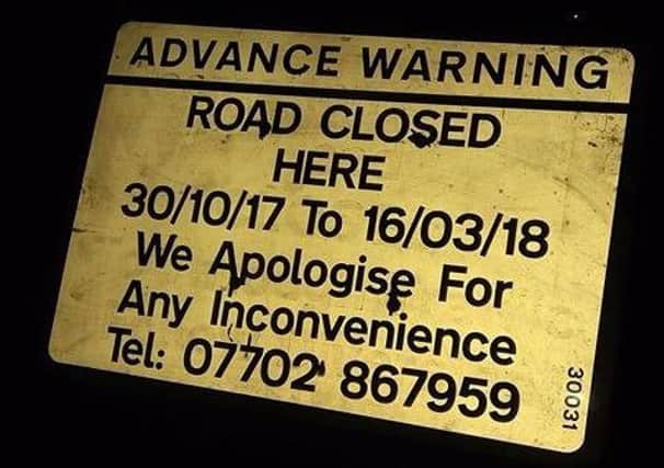 The sign warning drivers about the road closure
