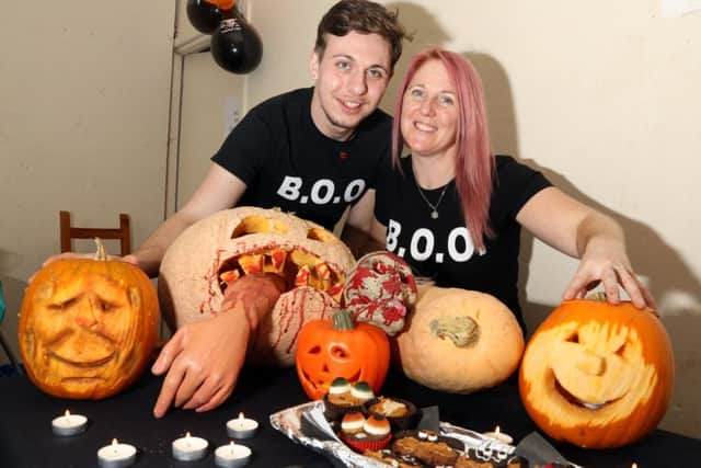 Pumpkin Carving: Kettering: Johnny's Happy Place pumpkin carving event.
Daniel Kelly (artist) with Kellie Gilbey from BOO (Bridge of Opportunity)
Sunday October 29, 2017 NNL-171029-154944009