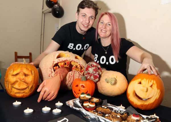 Pumpkin Carving: Kettering: Johnny's Happy Place pumpkin carving event. 
Daniel Kelly (artist) with Kellie Gilbey from BOO (Bridge of Opportunity)
Sunday October 29, 2017 NNL-171029-154944009