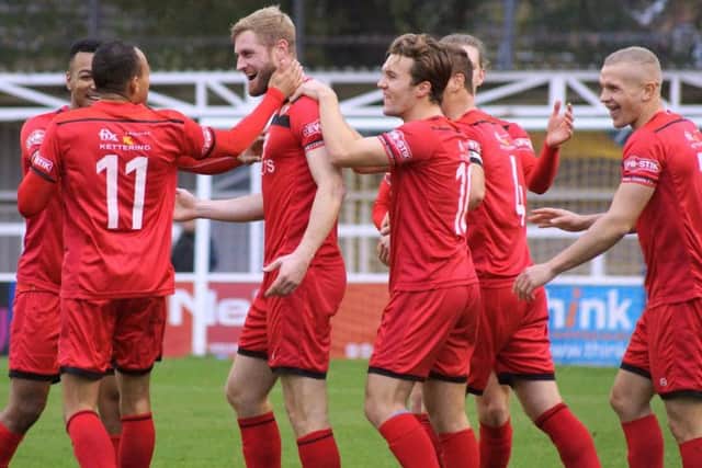 Gary Mulligan takes the congratulations after he scored Kettering Town's second goal in the 4-3 success at Farnborough. Pictures by Peter Short