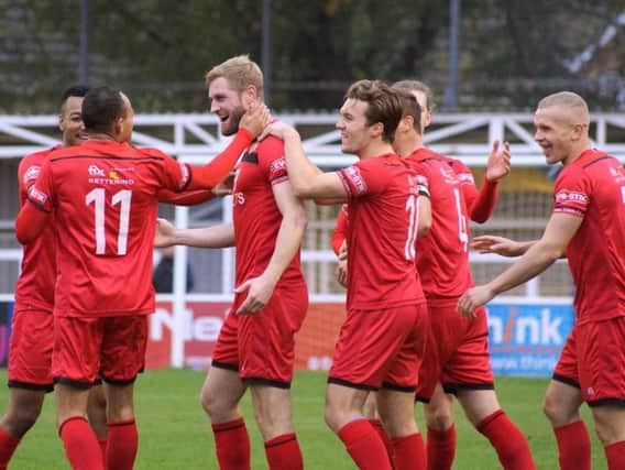 Gary Mulligan takes the congratulations after he scored Kettering Town's second goal in the 4-3 success at Farnborough. Pictures by Peter Short