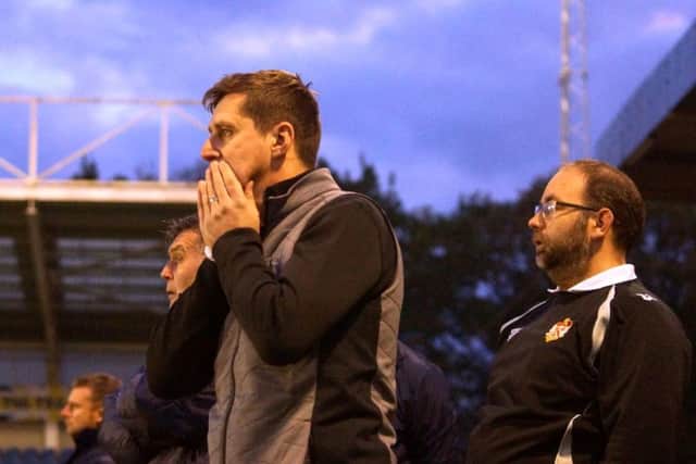 Kettering boss Marcus Law watches on at Farnborough