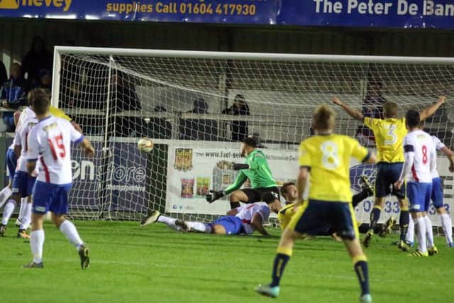 Stephen Hutchings' late header finds the net to earn Moneyfields a point
