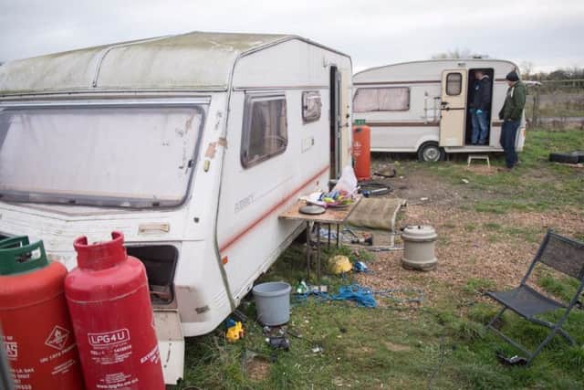 Officers searching one of the caravans