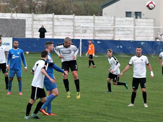 Action from Corby Town's 3-0 defeat at Frickley Athletic. Picture by David Tilley