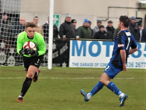 Corby Town goalkeeper Sam Wilson collects the ball during the 1-1 draw with Cleethorpes Town at Steel Park. Picture by David Tilley