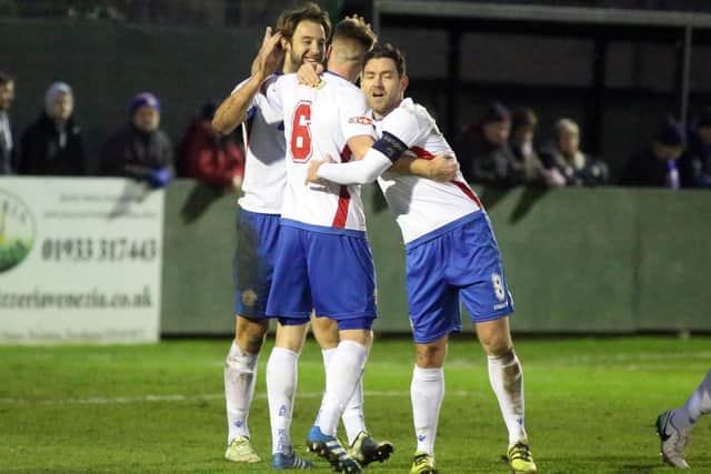 Ben Farrell takes the congratulations after scoring AFC Rushden & Diamonds' second goal in the 4-0 success over Northwood. Pictures by Alison Bagley