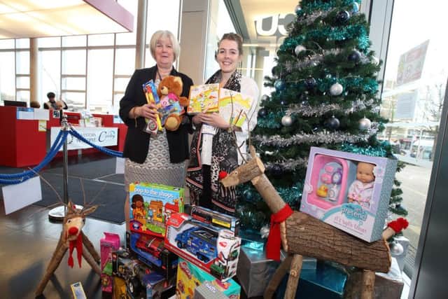 Gifts can be dropped off at The Corby Cube.
 Pictured are Cllr Jean Addison and Megan Gourlay with some of the gifts donated last year